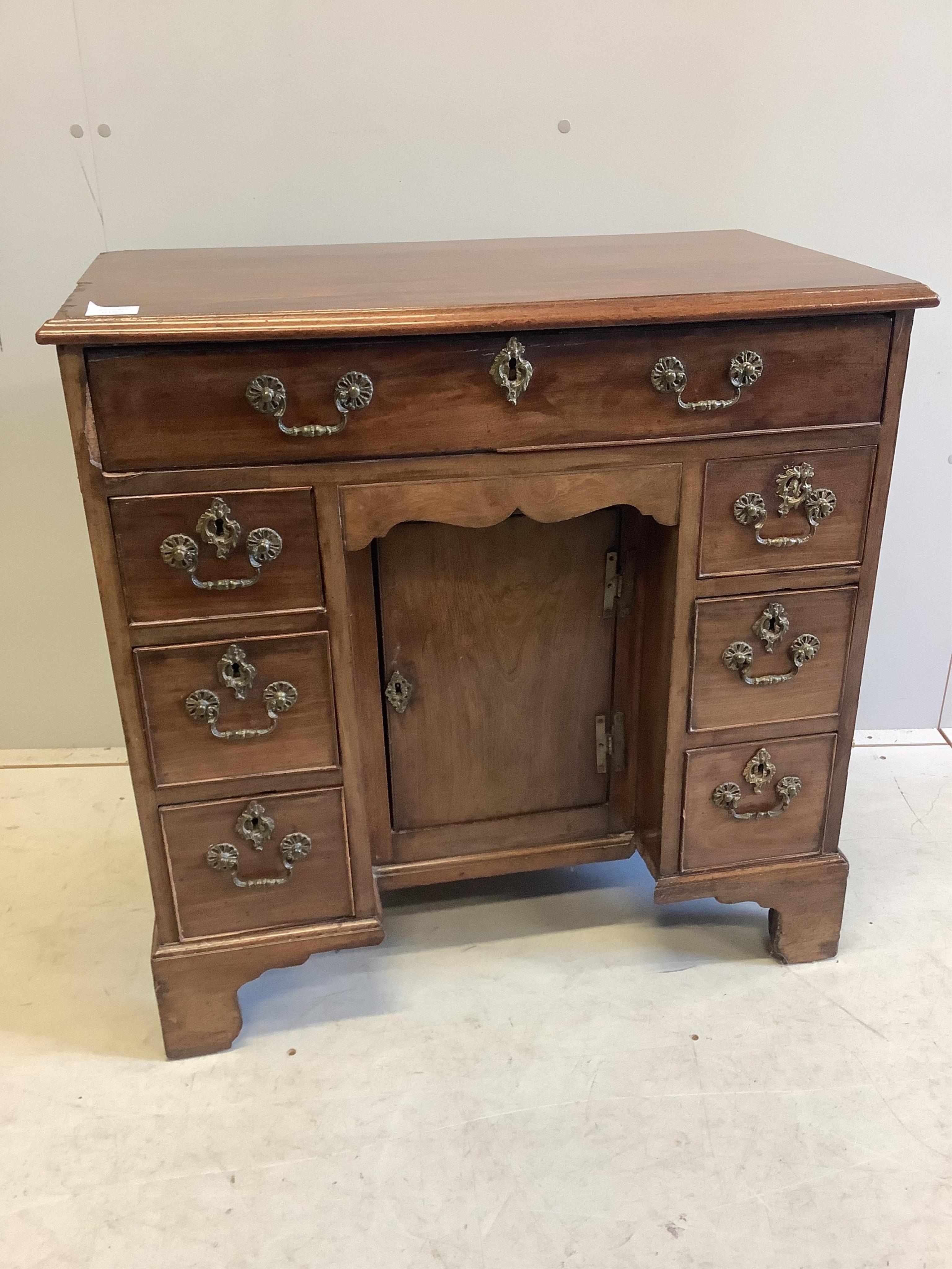 A George III mahogany kneehole desk, width 78cm, depth 43cm, height 78cm. Condition - poor